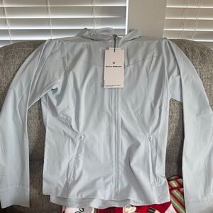 Lululemon mist over wind breaker Light Blue Zip-Up Jacket size 10. Brand new